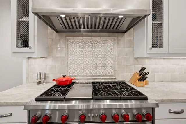 a bedroom with furniture and a flat screen tv