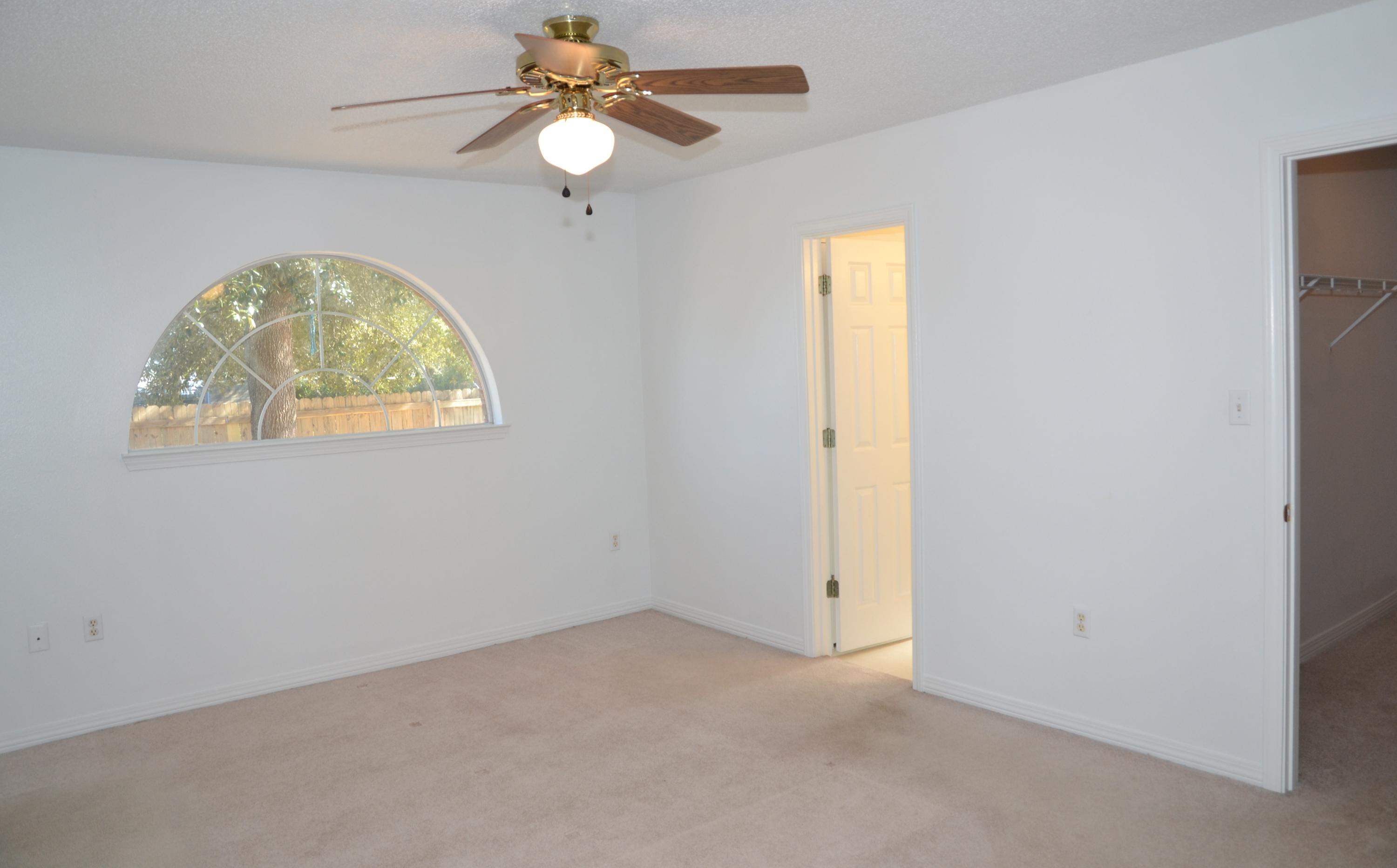 729 Riva Ridge Drive Crestview, FL 32539 - Photo 14 of 40 an empty room with windows and fan