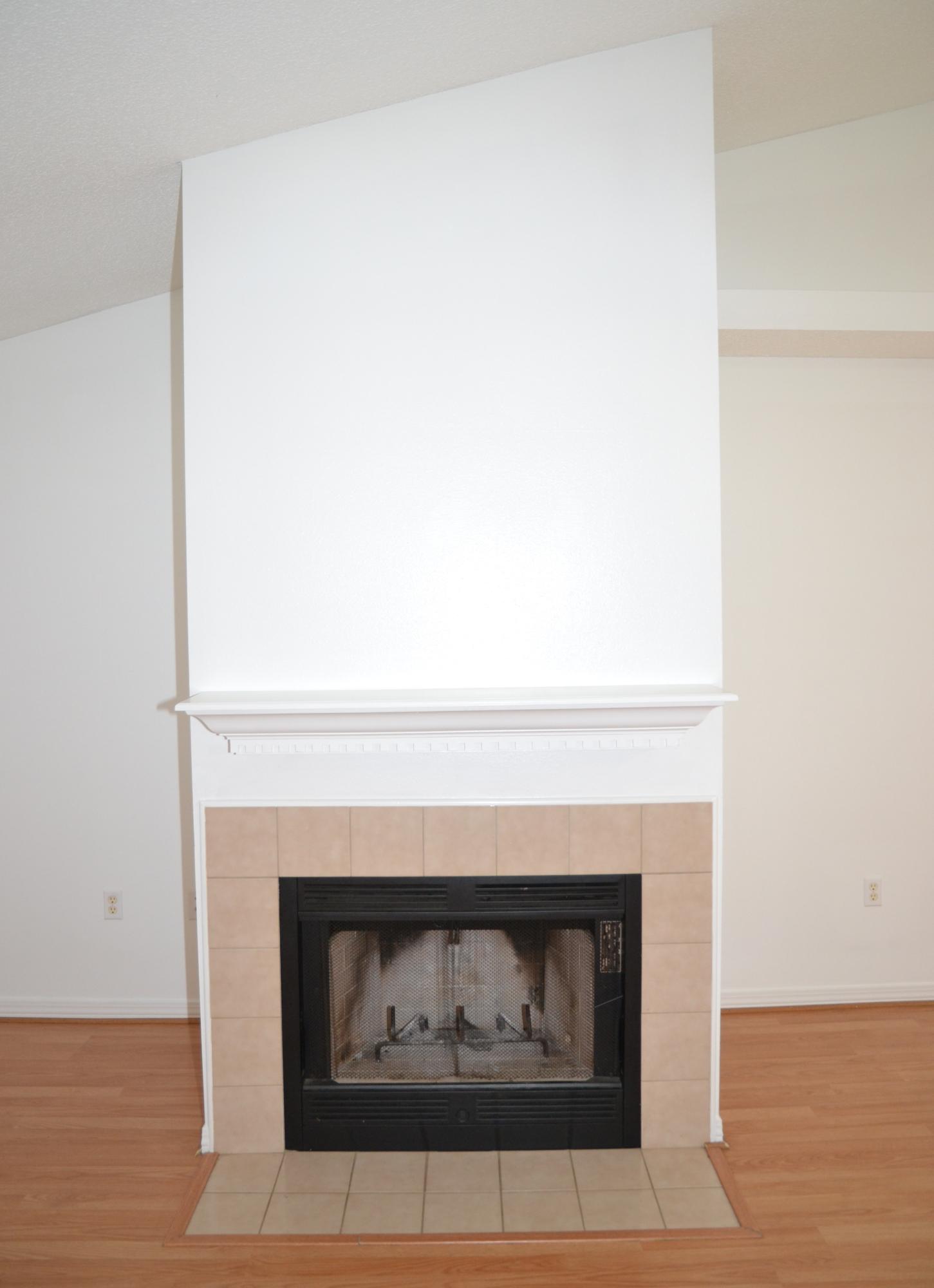 729 Riva Ridge Drive Crestview, FL 32539 - Photo 4 of 40 a fireplace with a clock on it