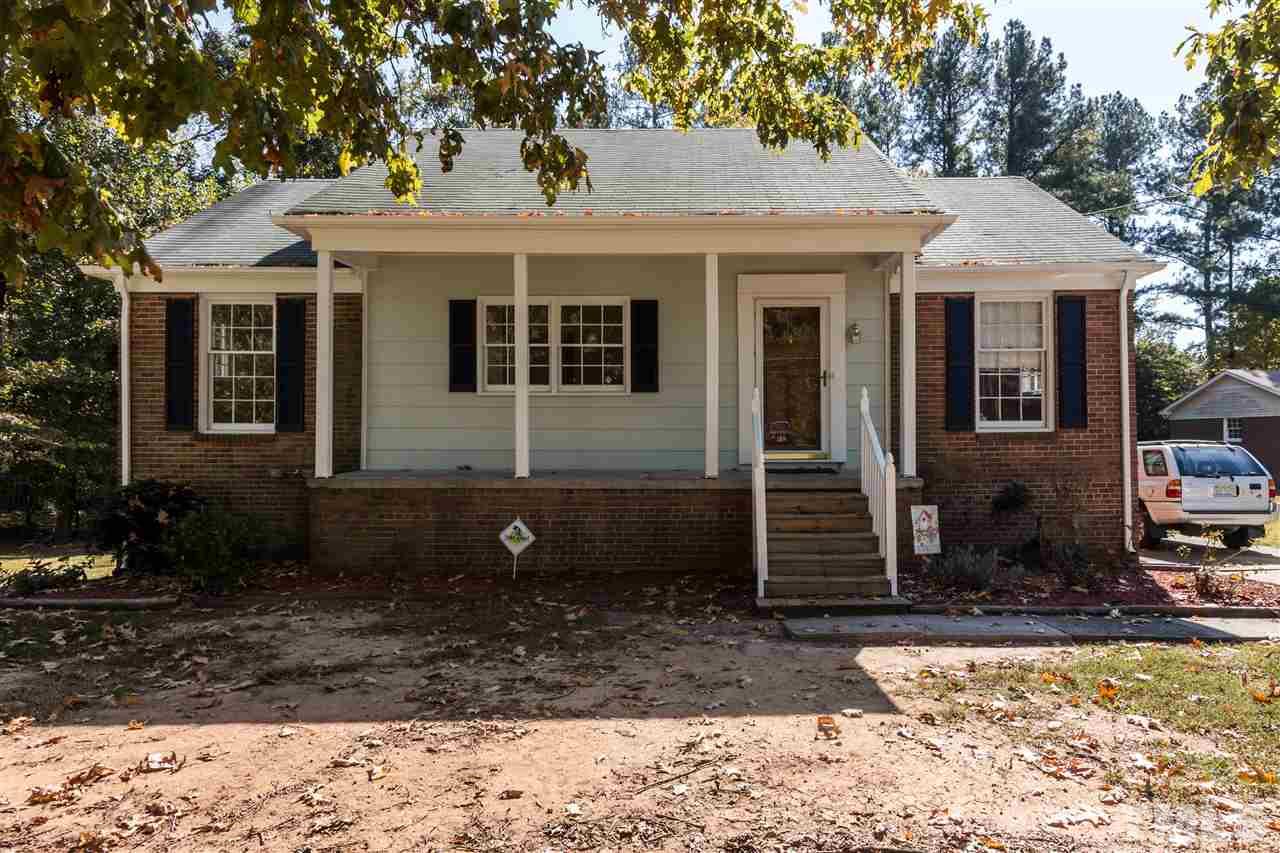 1506 Sedwick Road Durham, NC 27713 - Photo 1 of 21 a front view of a house with garden