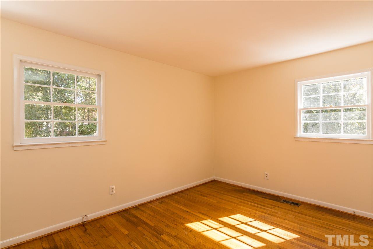 1506 Sedwick Road Durham, NC 27713 - Photo 17 of 21 an empty room with a window