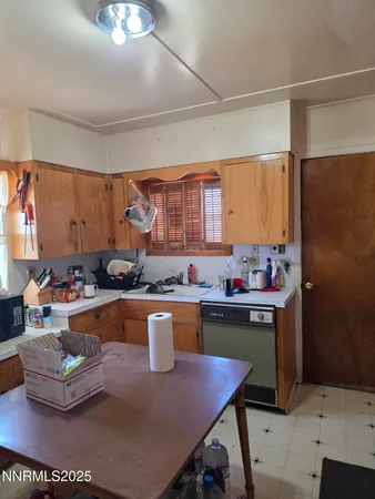 a kitchen with a sink appliances and cabinets