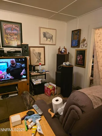 a bedroom with bed and a couch