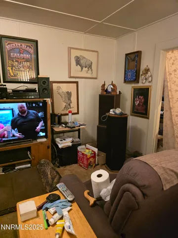 a bedroom with bed and a couch