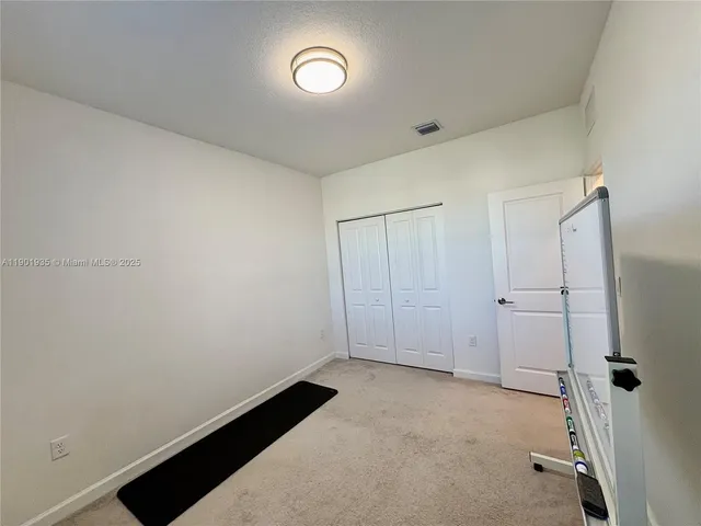 a view of a closet area with empty room