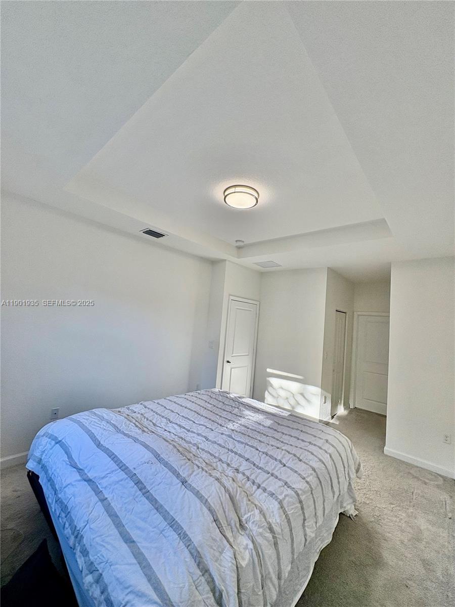 1020 Southeast 26th Street Homestead, FL 33035 - Photo 39 of 47 a bedroom with a bed and a window