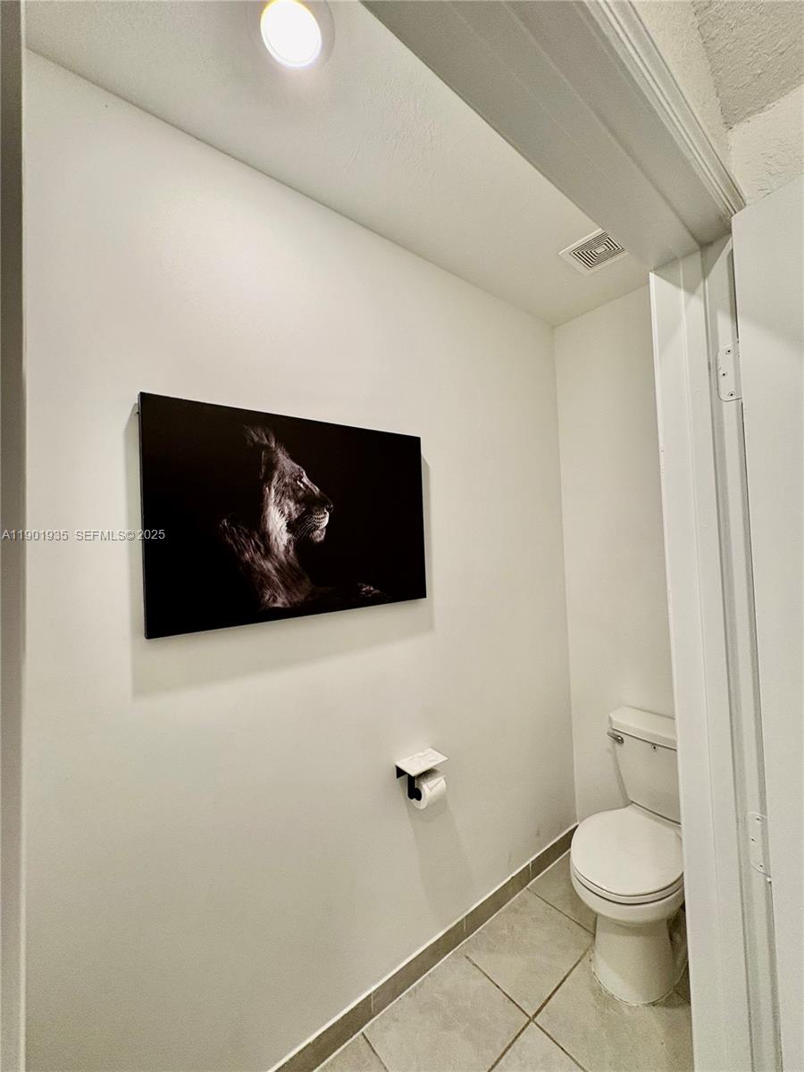 1020 Southeast 26th Street Homestead, FL 33035 - Photo 40 of 47 a bathroom with a toilet and a shower
