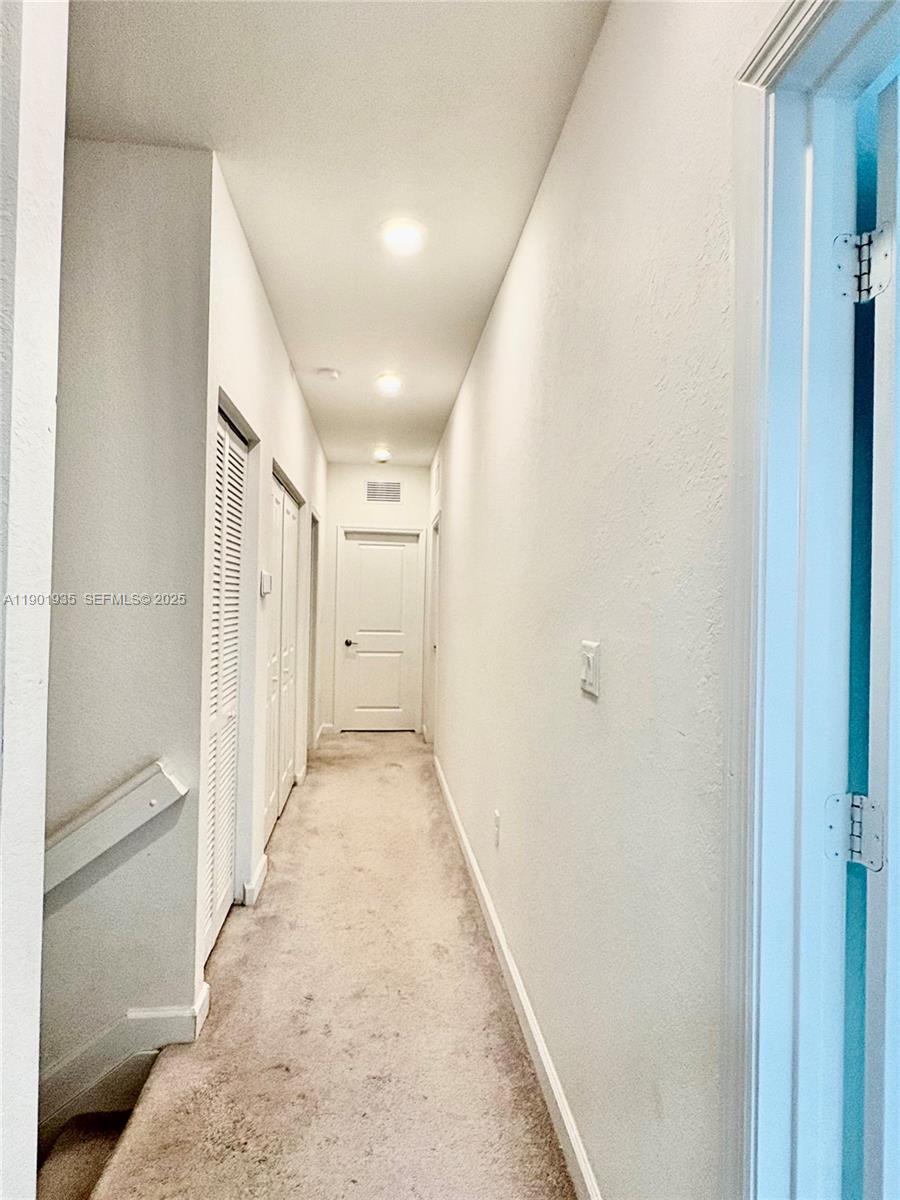 1020 Southeast 26th Street Homestead, FL 33035 - Photo 6 of 47 a view of a hallway