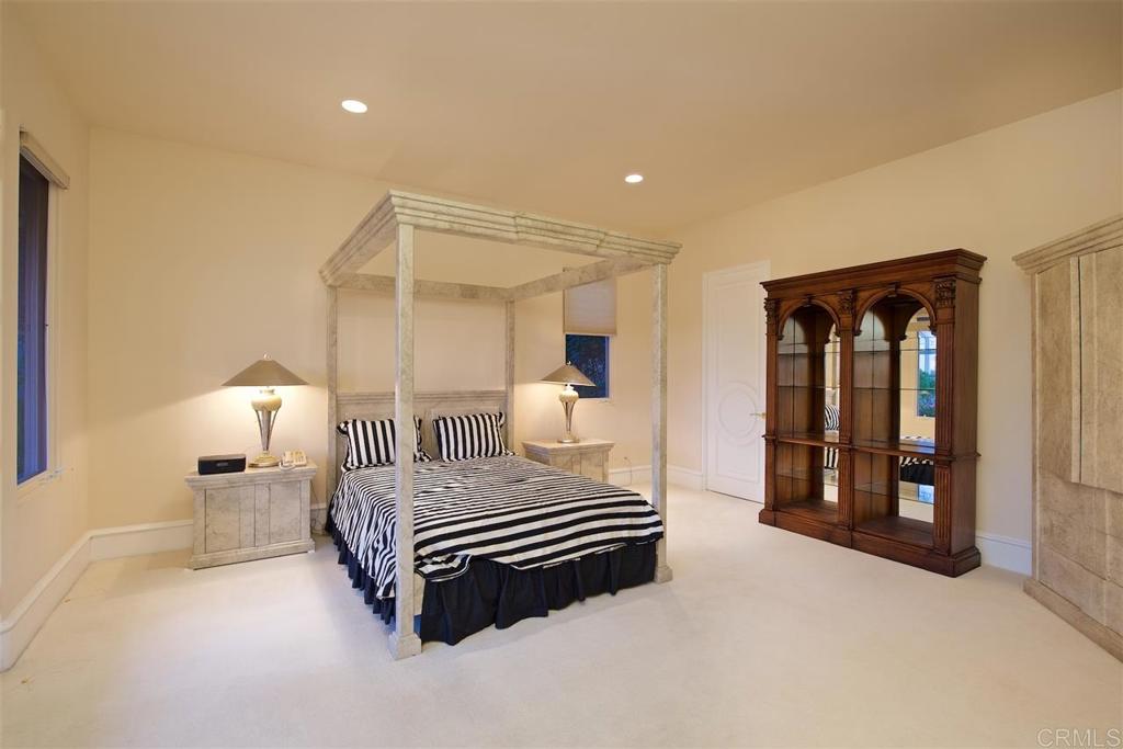 6827 Alydar Corte Del Mar, CA 92014 - Photo 16 of 24 a bedroom with a bed and a cabinets