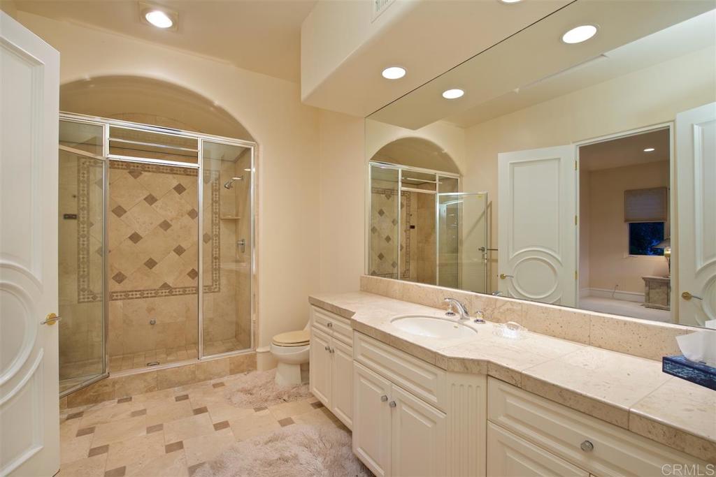 6827 Alydar Corte Del Mar, CA 92014 - Photo 17 of 24 a spacious bathroom with a double vanity sink toilet and shower