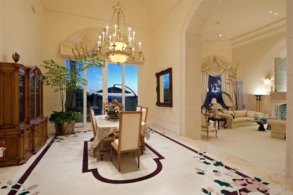 6827 Alydar Corte Del Mar, CA 92014 - Photo 6 of 24 a living room with lots of furniture and a chandelier