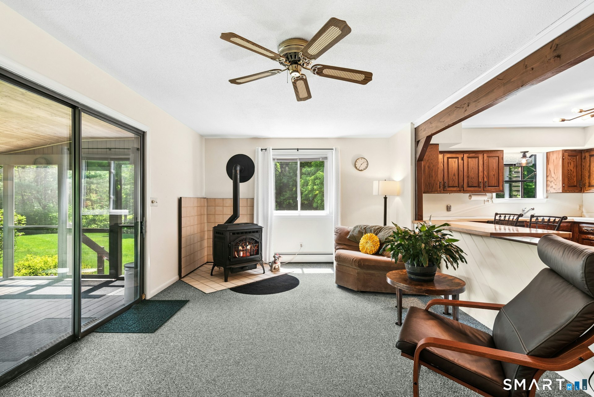 127 Huntingtown Road Newtown, CT 06470 - Photo 14 of 38 a living room with furniture and a floor to ceiling window