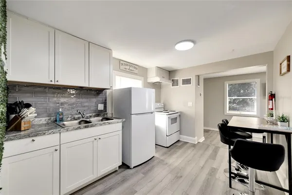 a kitchen with a sink and cabinets