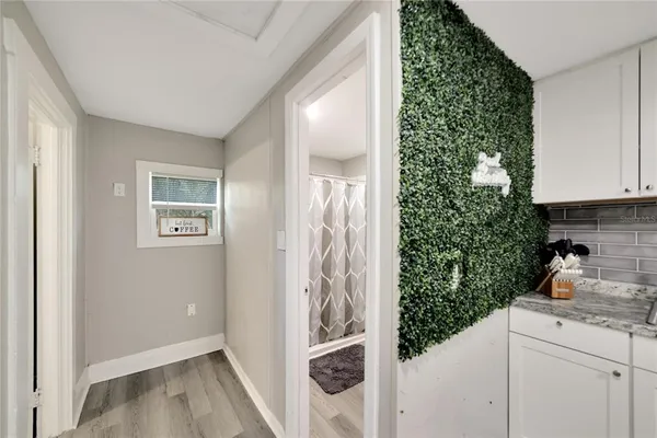 a bathroom with a shower and a mirror