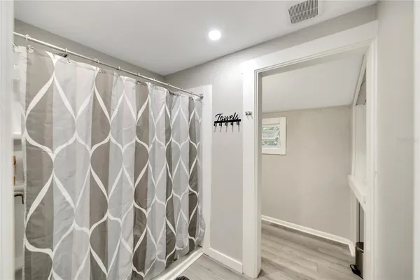 a view of entryway with wooden floor