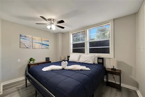 a bedroom with a bed and a table