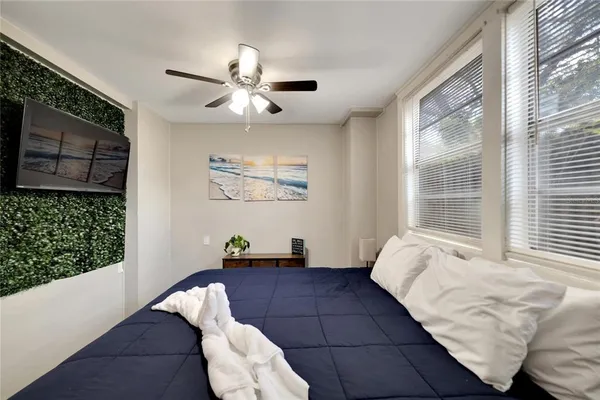 a bedroom with a bed and window