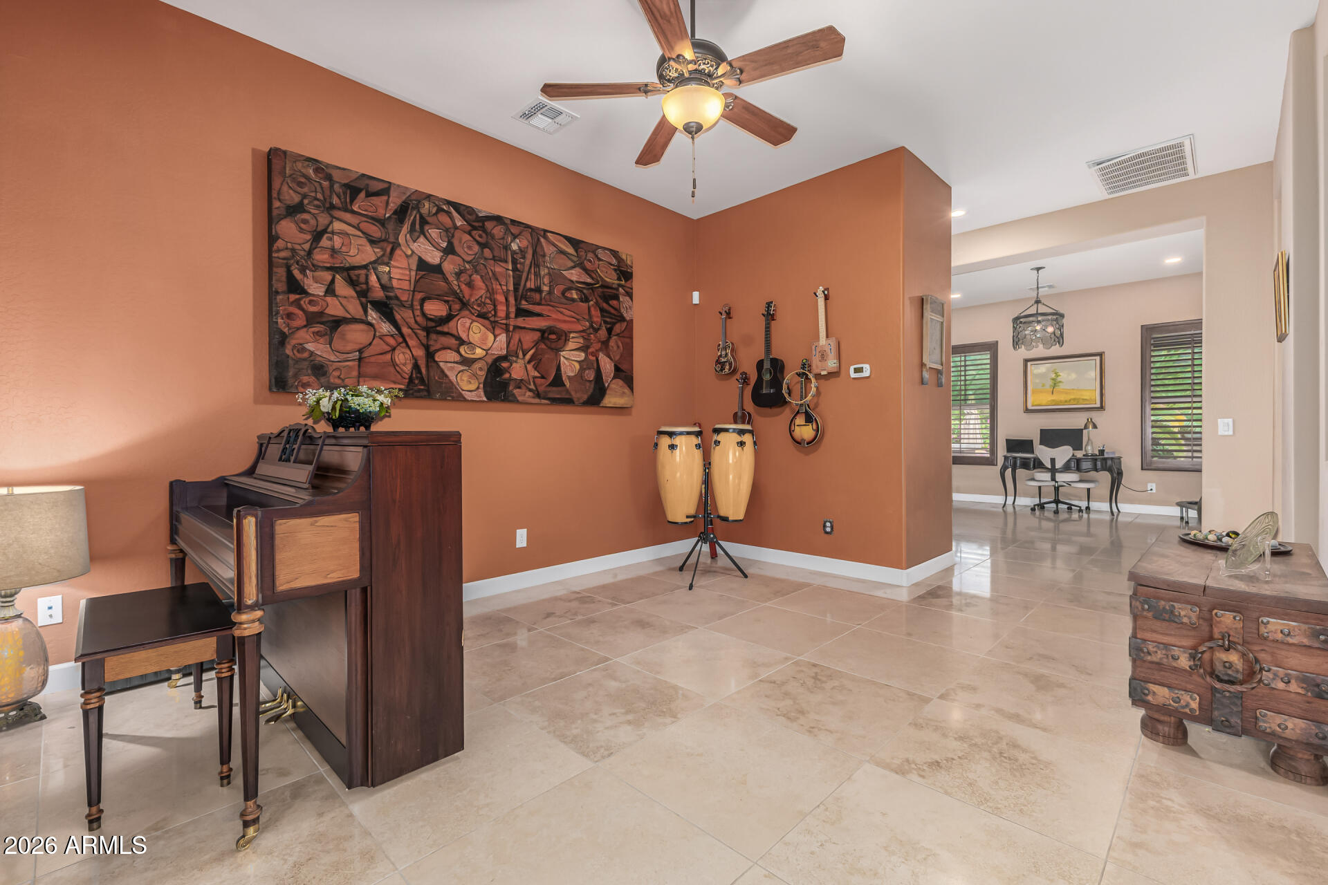 3139 East Harwell Road Phoenix, AZ 85042 - Photo 6 of 45 a view of a livingroom with furniture and a ceiling fan