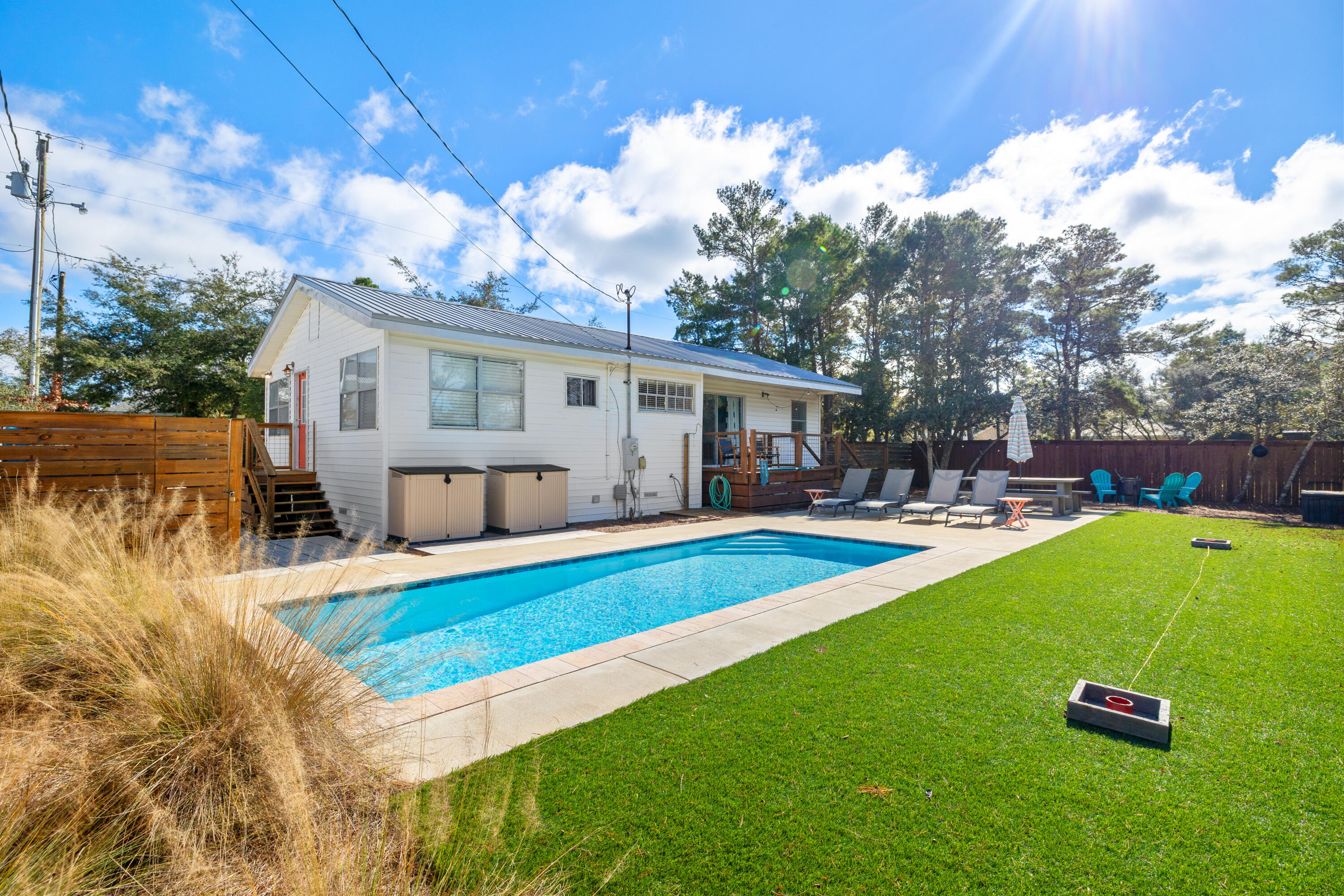 a view of a house with swimming pool yard and patio