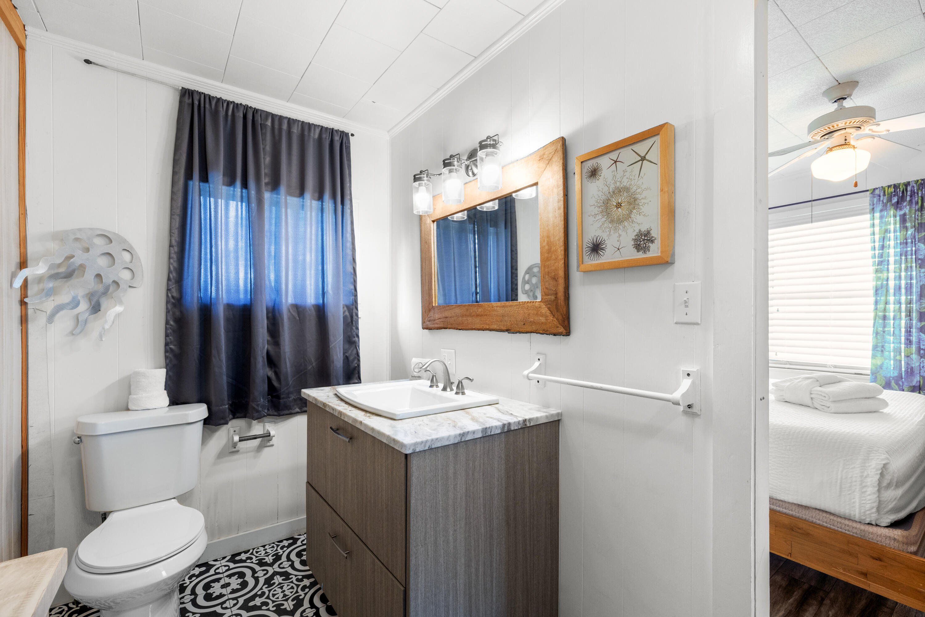 279 Robert Ellis Street Santa Rosa Beach, FL 32459 - Photo 11 of 29 a bathroom with a sink a toilet and shower