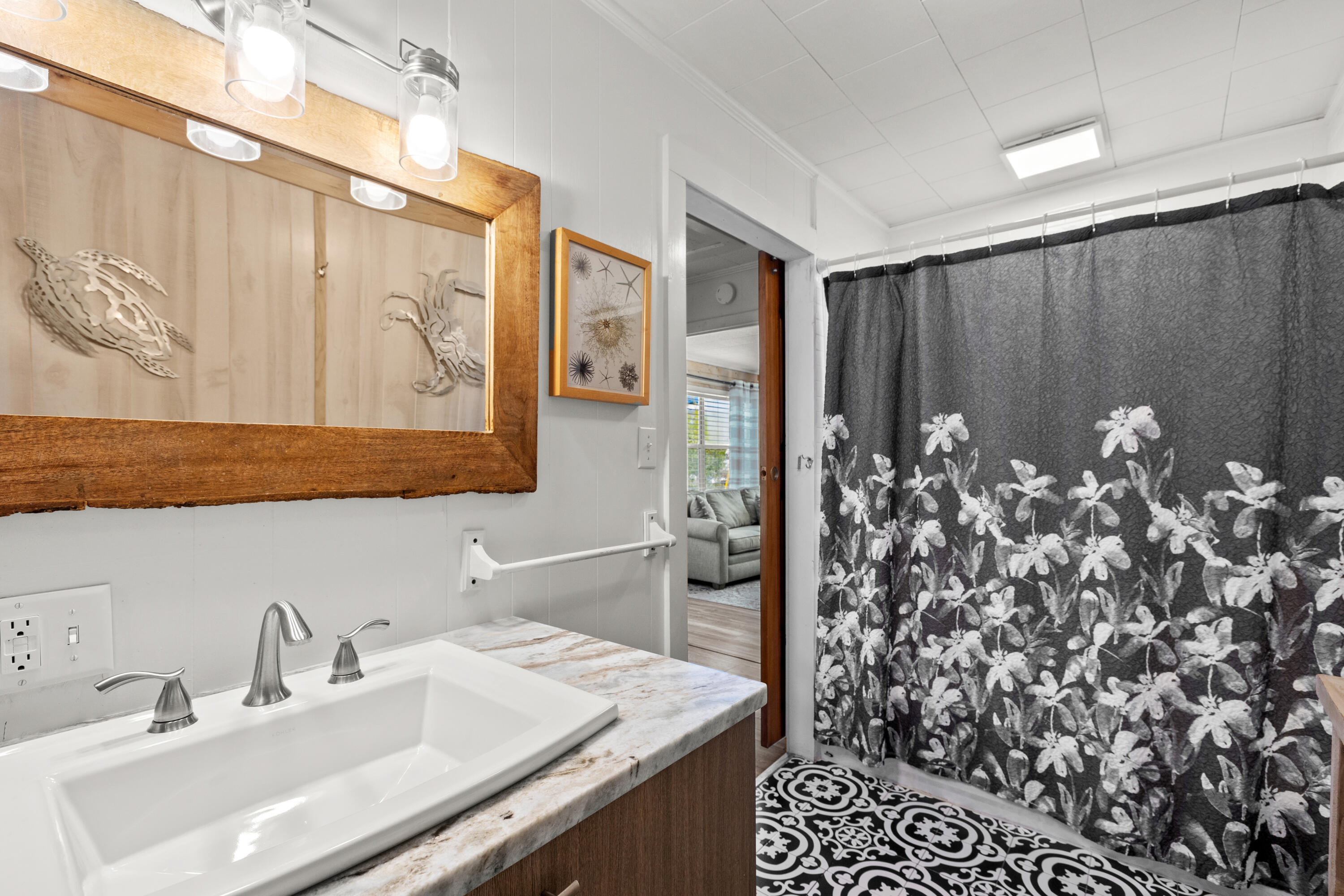 279 Robert Ellis Street Santa Rosa Beach, FL 32459 - Photo 12 of 29 a bathroom with a sink and a mirror