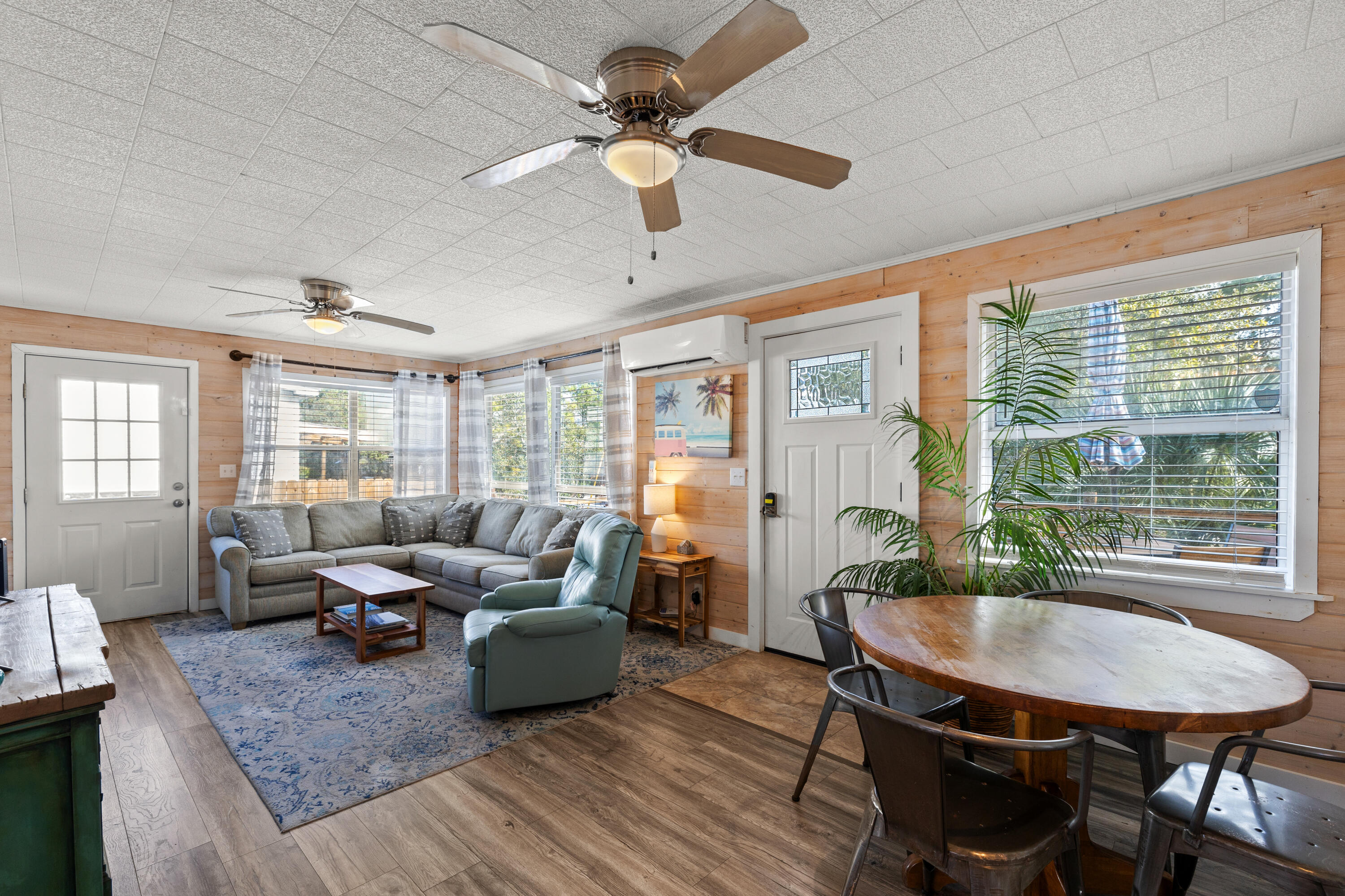 279 Robert Ellis Street Santa Rosa Beach, FL 32459 - Photo 14 of 29 a living room with furniture a fireplace and a table