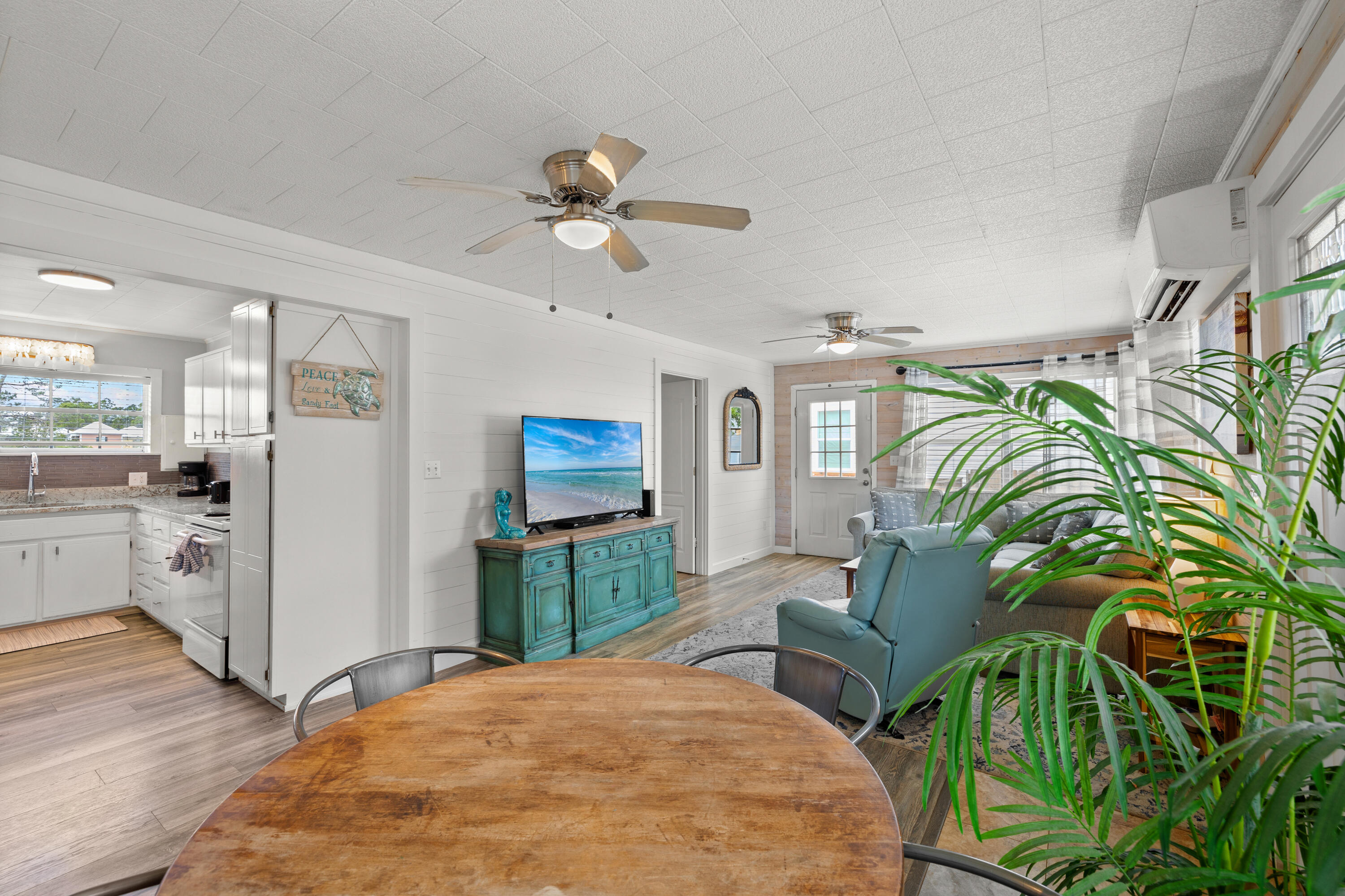 279 Robert Ellis Street Santa Rosa Beach, FL 32459 - Photo 9 of 29 a bedroom with furniture and a chandelier