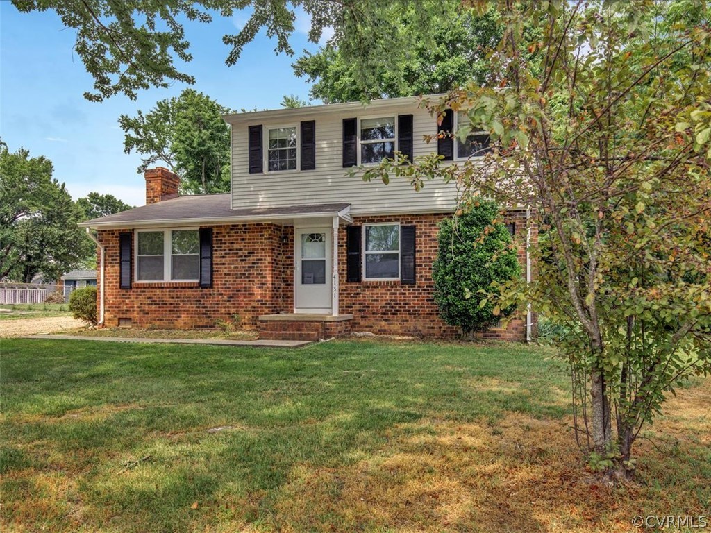 4131 Woodfield Road North Chesterfield, VA 23234 - Photo 1 of 20 a front view of a house with a garden