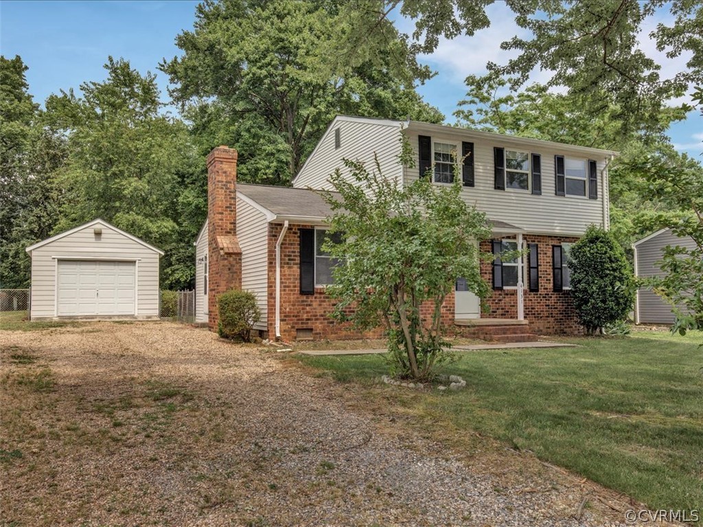 4131 Woodfield Road North Chesterfield, VA 23234 - Photo 2 of 20 a front view of a house with a yard and garage