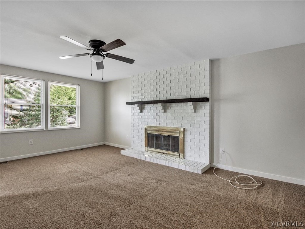4131 Woodfield Road North Chesterfield, VA 23234 - Photo 3 of 20 a view of an empty room with a fireplace and a window