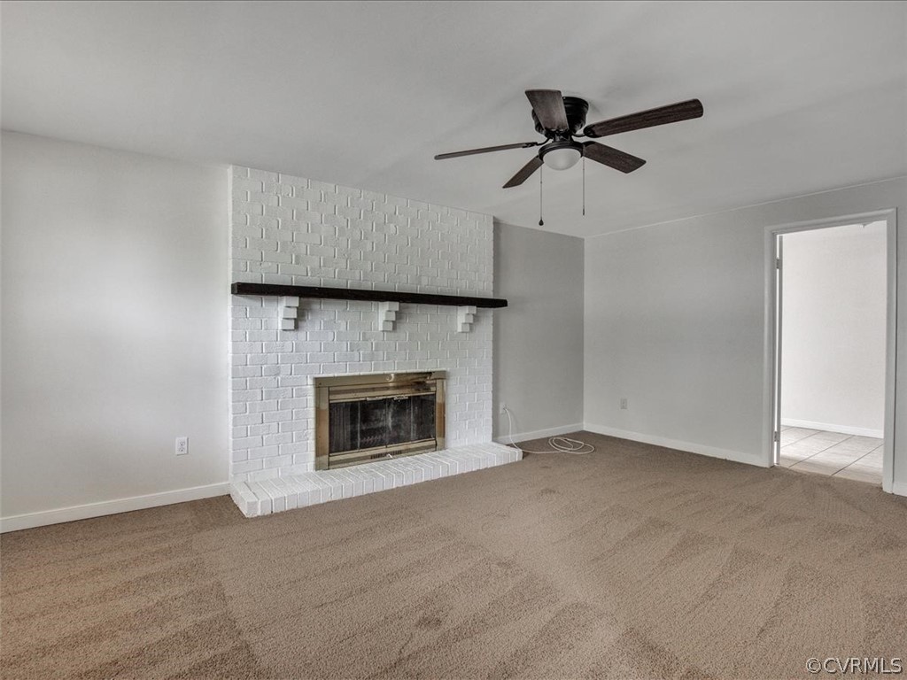 4131 Woodfield Road North Chesterfield, VA 23234 - Photo 4 of 20 a view of an empty room with a fireplace