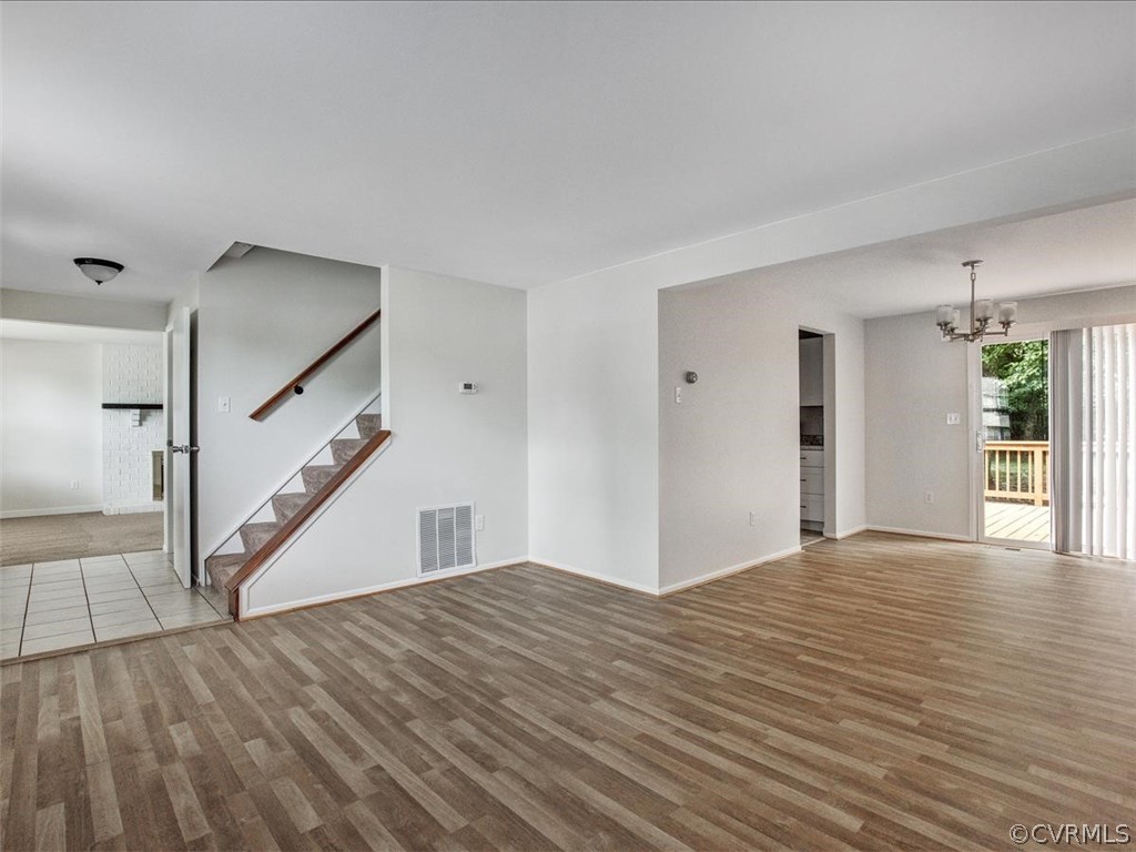 4131 Woodfield Road North Chesterfield, VA 23234 - Photo 7 of 20 a view of a big room with wooden floor and stairs