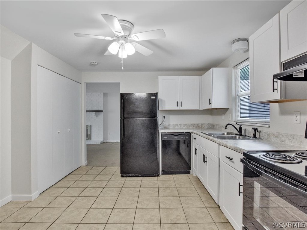 4131 Woodfield Road North Chesterfield, VA 23234 - Photo 9 of 20 a kitchen with a stove a sink and a refrigerator