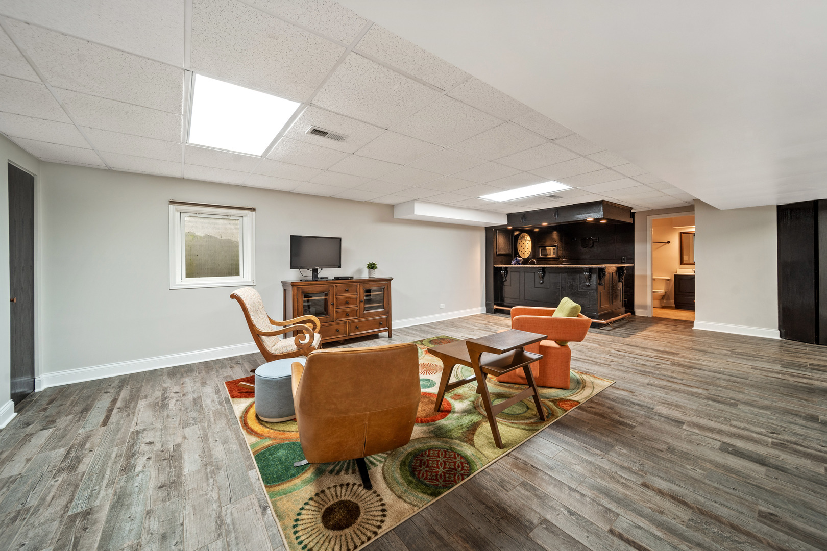 28W140 Mack Road Wheaton, IL 60189 - Photo 35 of 48 a living room with furniture and a wooden floor