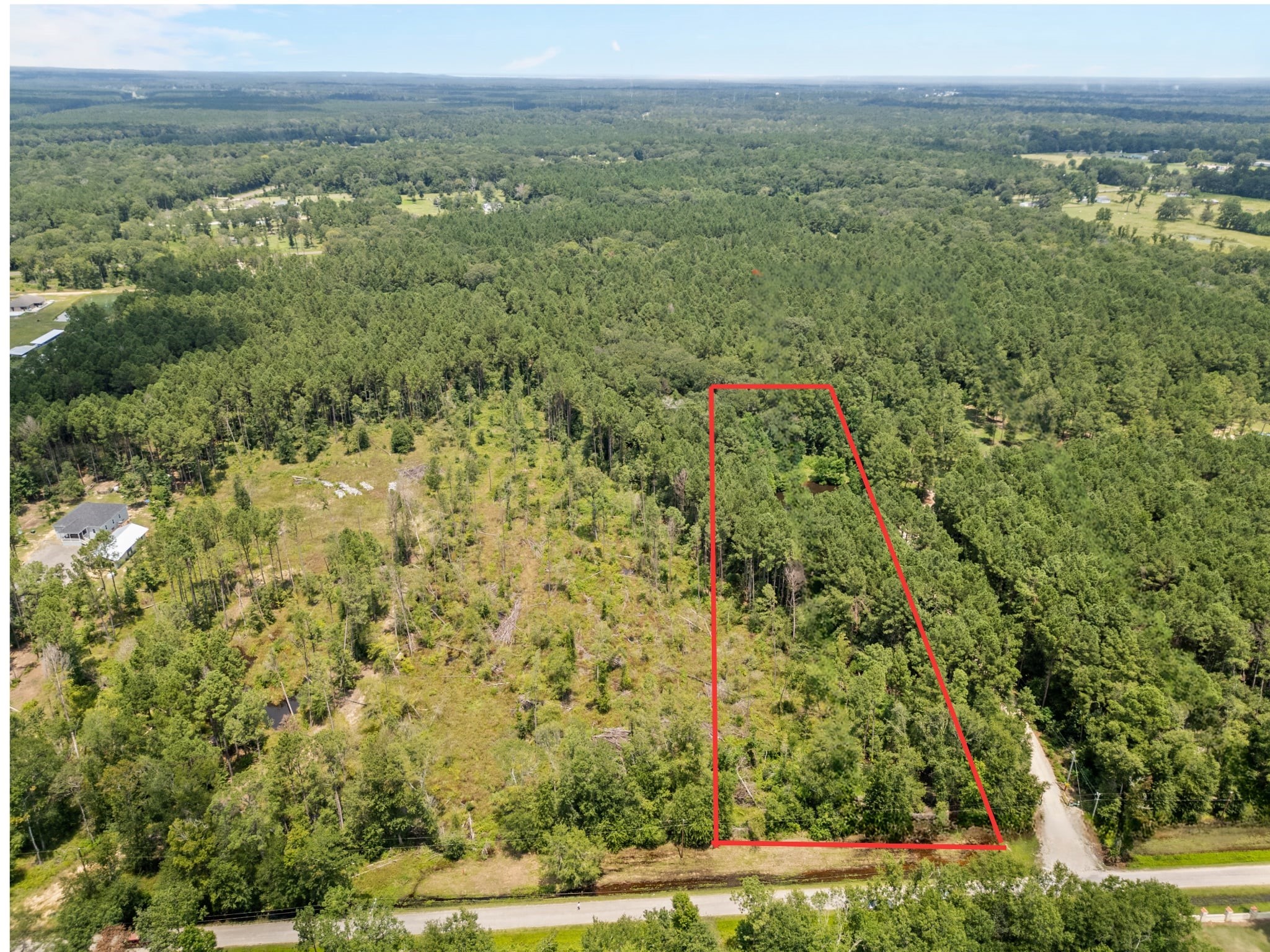 a view of a field with an trees