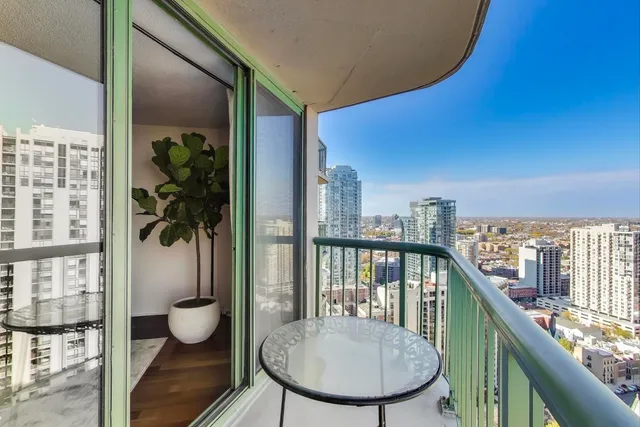 a view of a balcony with chair and table