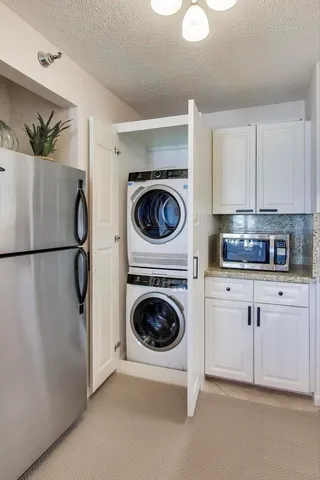 a kitchen with a washer and dryer
