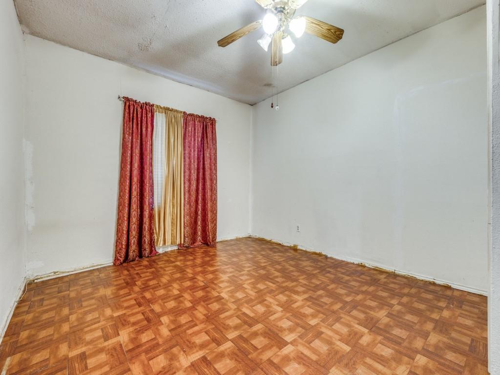 4942 Terry Street Dallas, TX 75223 - Photo 16 of 25 Empty room with a ceiling fan