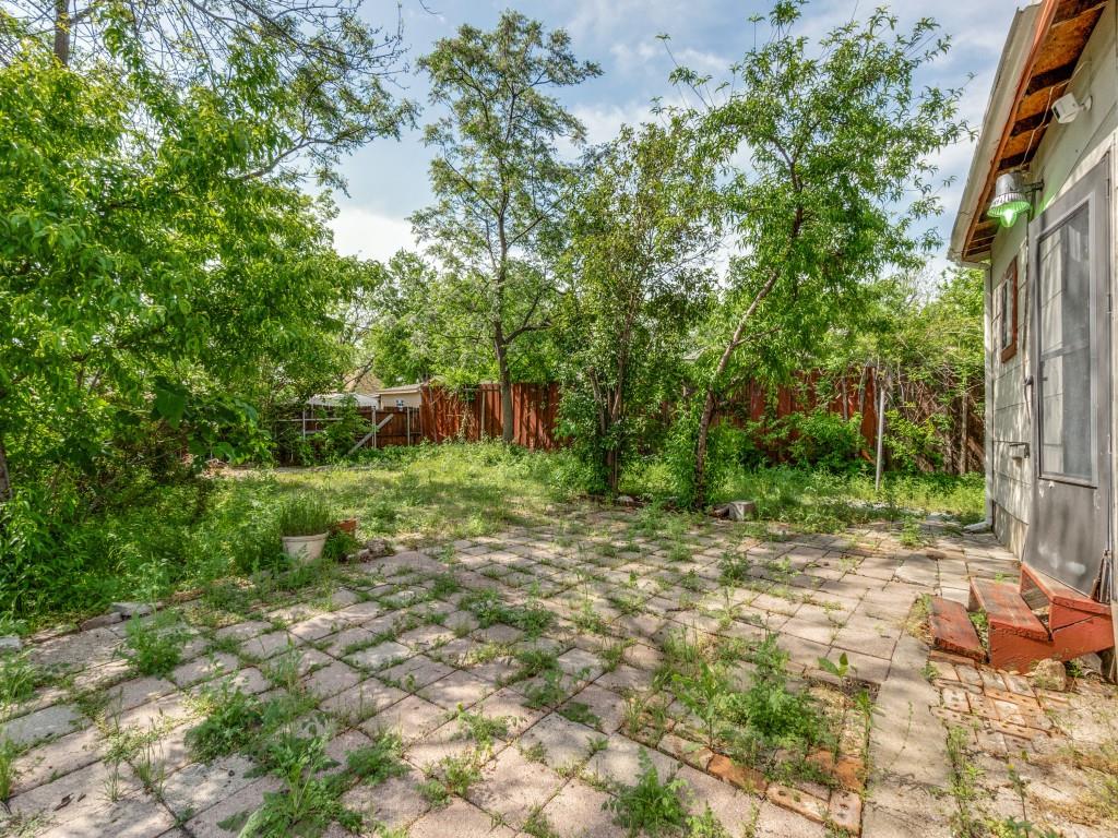 4942 Terry Street Dallas, TX 75223 - Photo 23 of 25 View of yard with a fenced backyard and a patio area
