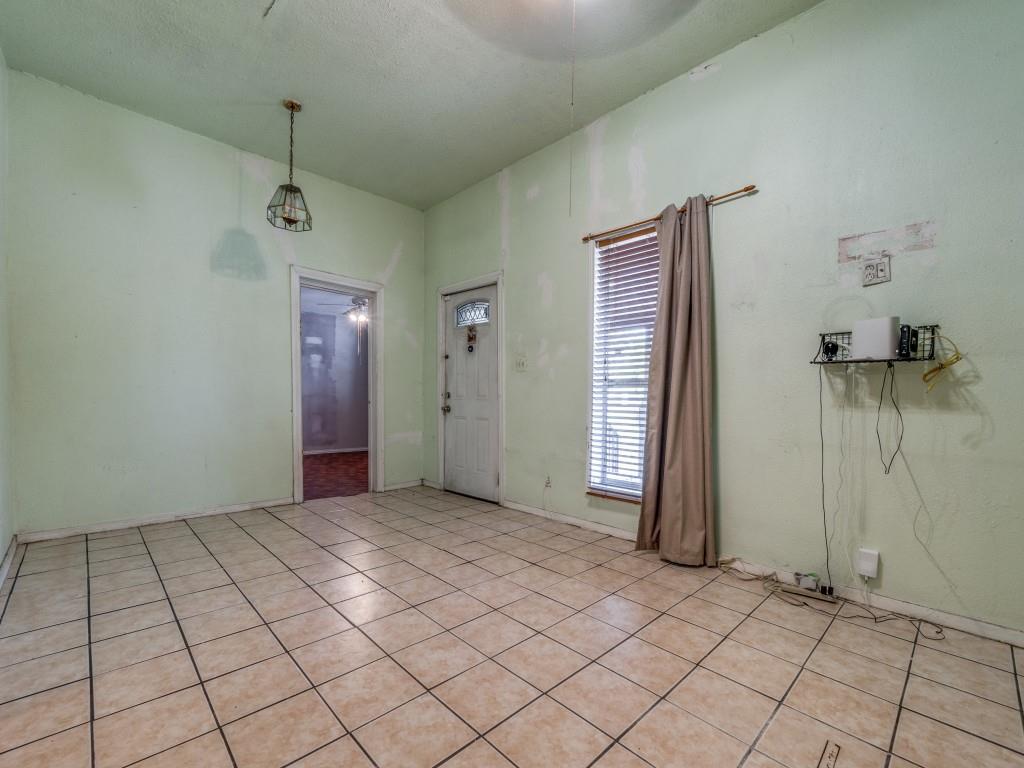 4942 Terry Street Dallas, TX 75223 - Photo 6 of 25 Unfurnished room featuring light tile patterned floors