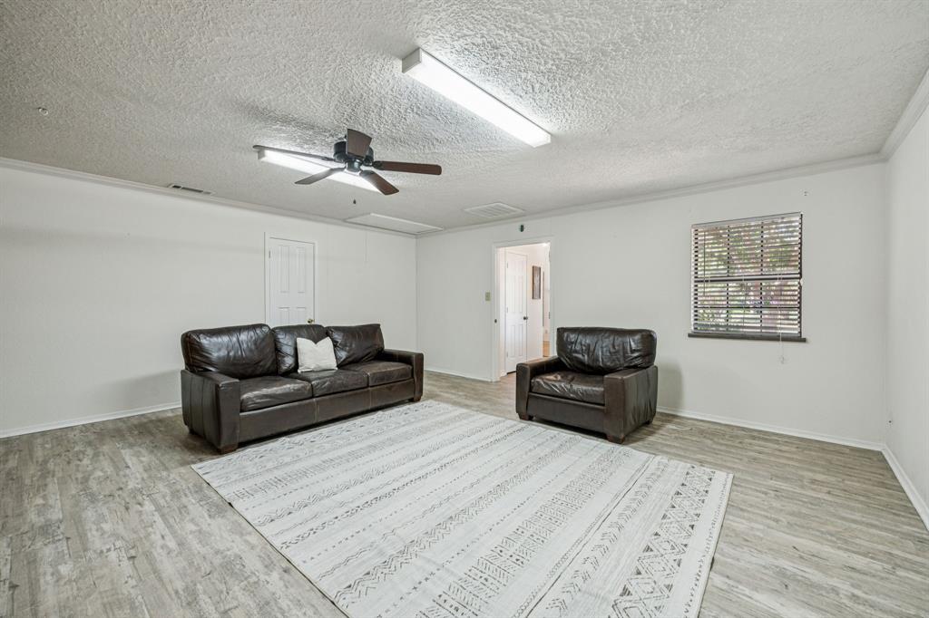 2900 Christopher Drive Denton, TX 76209 - Photo 13 of 25 a living room with furniture and a wooden floor