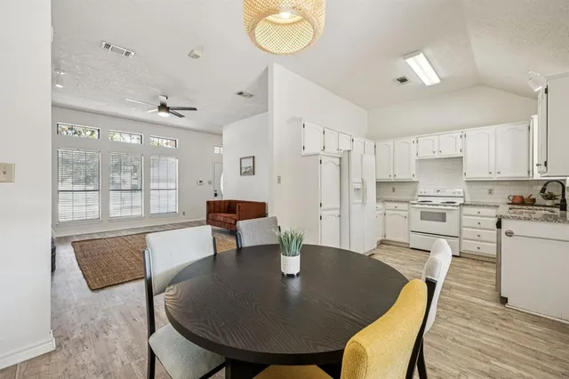 a view of kitchen with dining table and chairs
