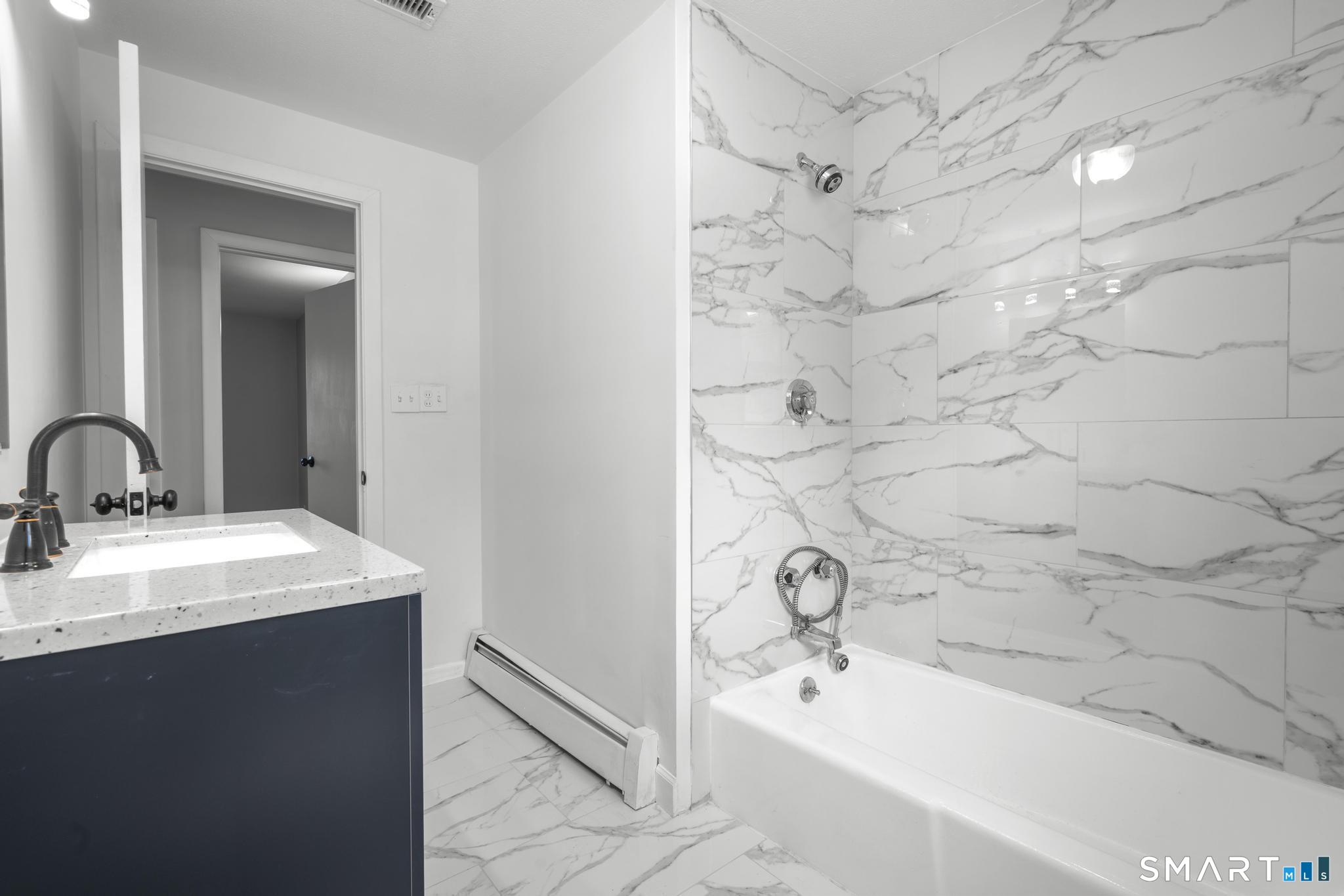 13 Allen Street Bristol, CT 06010 - Photo 18 of 40 a bathroom with a sink and a mirror