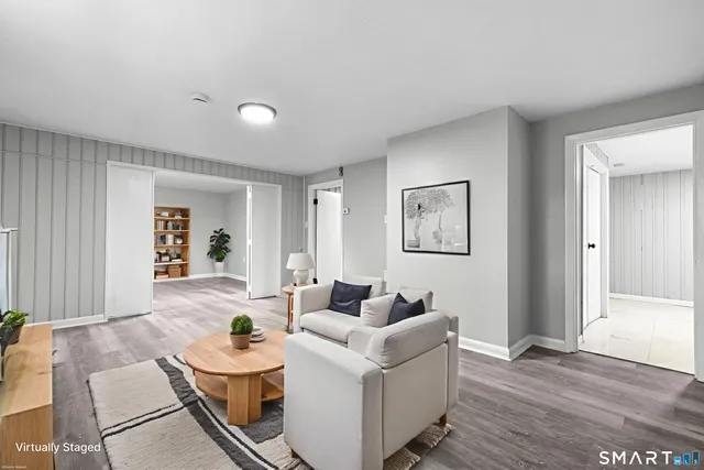 a view of empty room with wooden floor