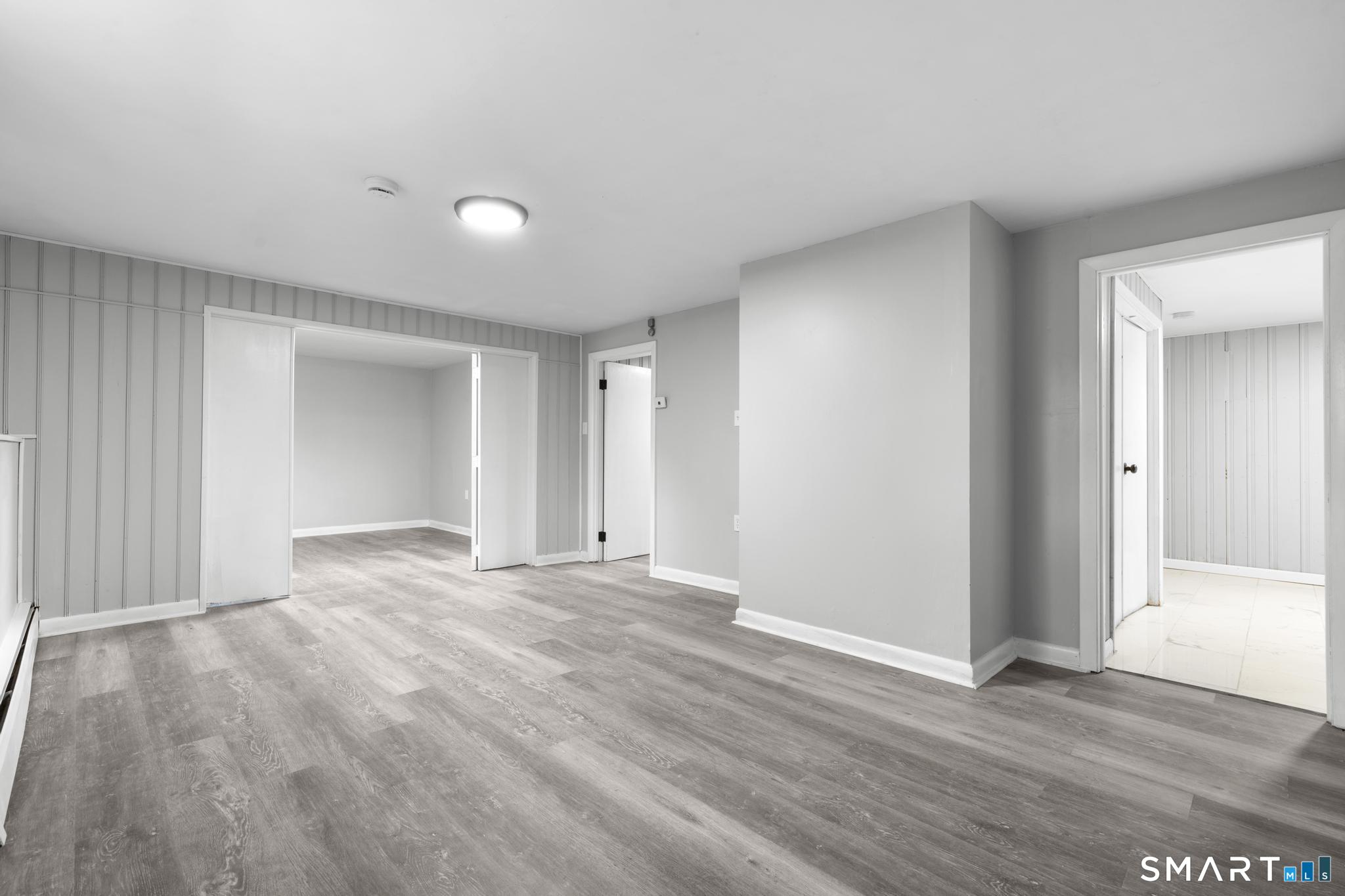 13 Allen Street Bristol, CT 06010 - Photo 31 of 40 a view of empty room with wooden floor