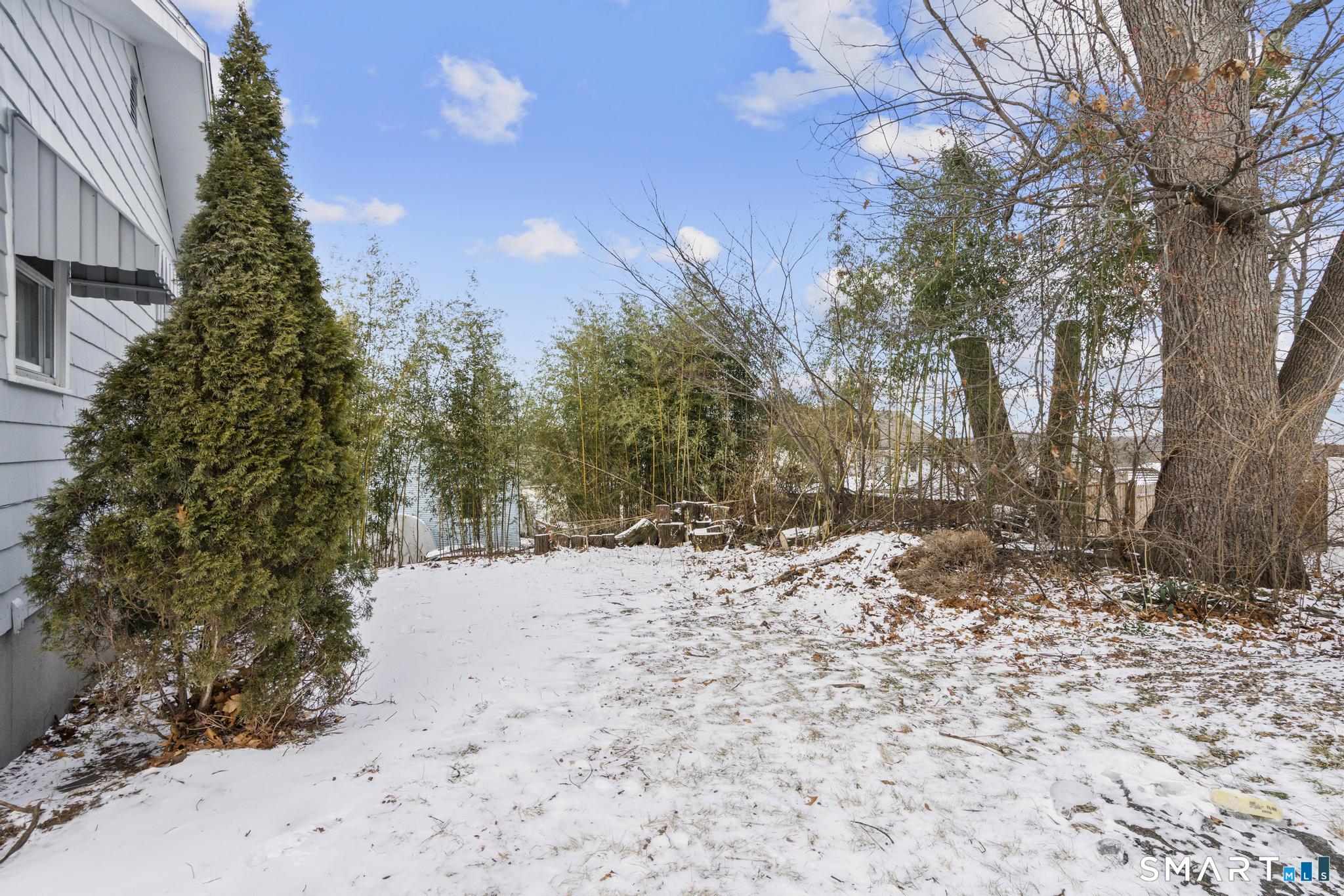 13 Allen Street Bristol, CT 06010 - Photo 36 of 40 a view of a yard covered in snow