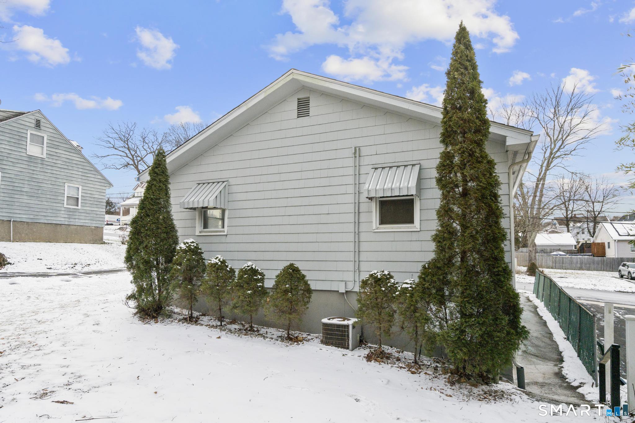 13 Allen Street Bristol, CT 06010 - Photo 37 of 40 a front view of a house with a yard
