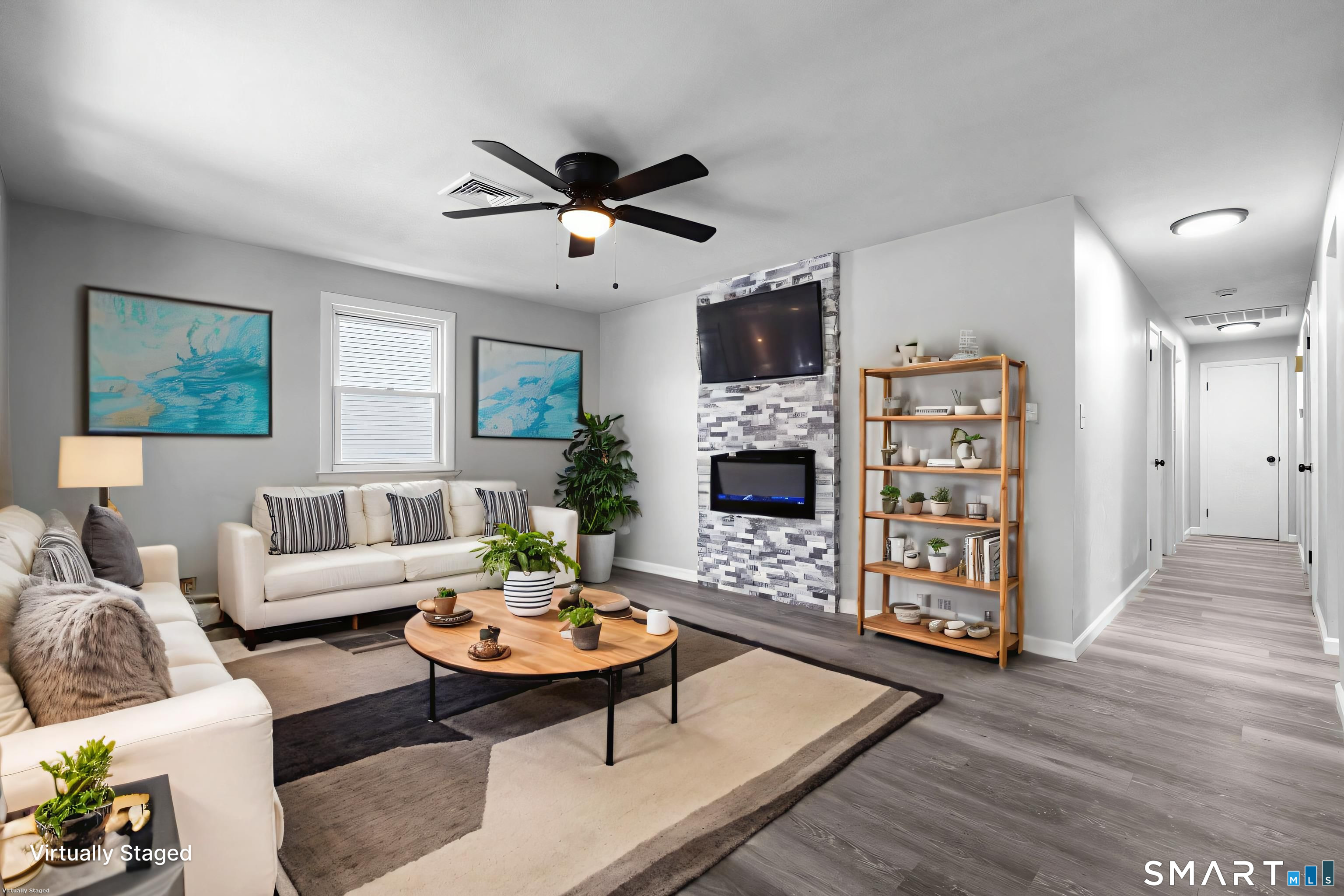 13 Allen Street Bristol, CT 06010 - Photo 5 of 40 a living room with furniture a fireplace and a flat screen tv