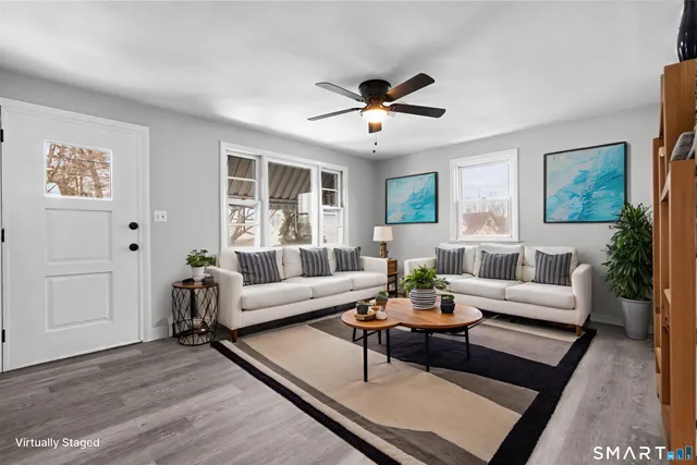 a living room with furniture and a large window