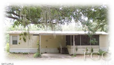 17901 Persimmon Ridge Road Alva, FL 33920 - Photo 4 of 10 an outdoor view of house with outdoor space